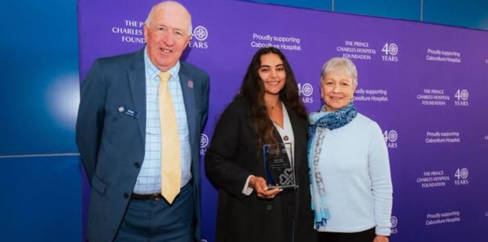 Eden Kharrouba receiving the Grant